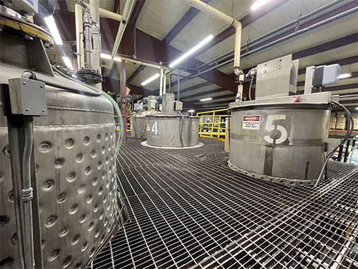 Production-scale mixing tanks numbered 4 and 5 on the Paradigm Labs manufacturing floor